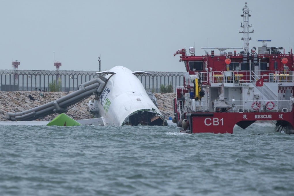 Flight EK9788 swerved off Hong Kong airport’s north runway while landing and struck a security patrol vehicle, killing two, on Monday morning. Photo: Sam Tsang