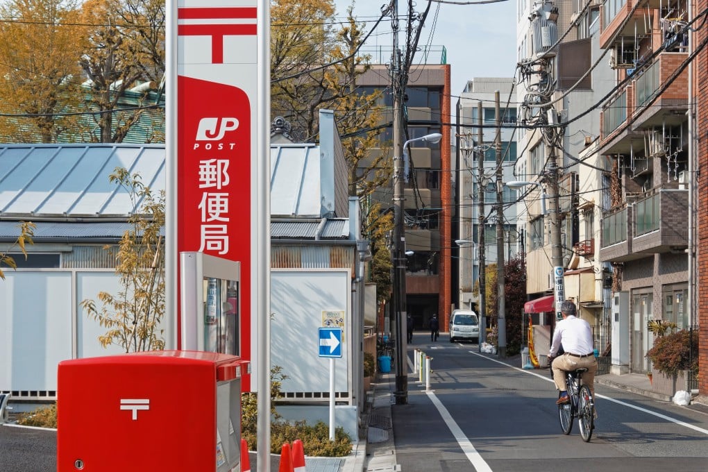 A Japan Post office in Tokyo. A Japan Post mailman was asked to complete his rounds on bicycle after a minor accident involving his work motorcycle. Photo: Shutterstock