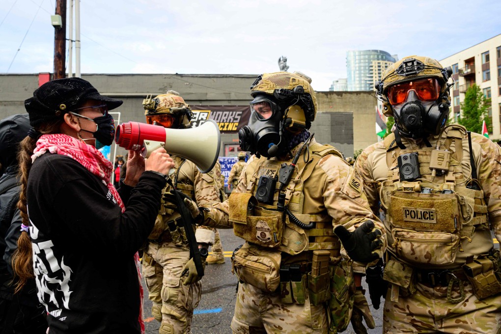 Federal agents clash with protesters at an ICE facility in Portland, Oregon. Photo: AFP