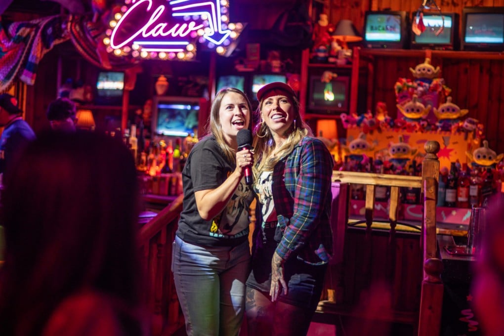 People sing karaoke at Bunga 90, a ’90s-themed bar, karaoke and pizza venue in London. The decade continues to dominate culture, and experts offer insights as to why. Photo: Bunga 90