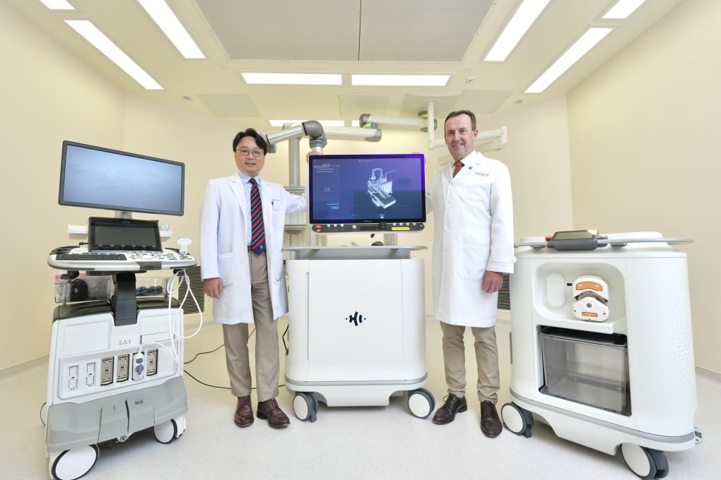 (From left) Professor Kenneth Chok and Professor James Griffith pose with histotripsy equipment. Photo: Karma Lo