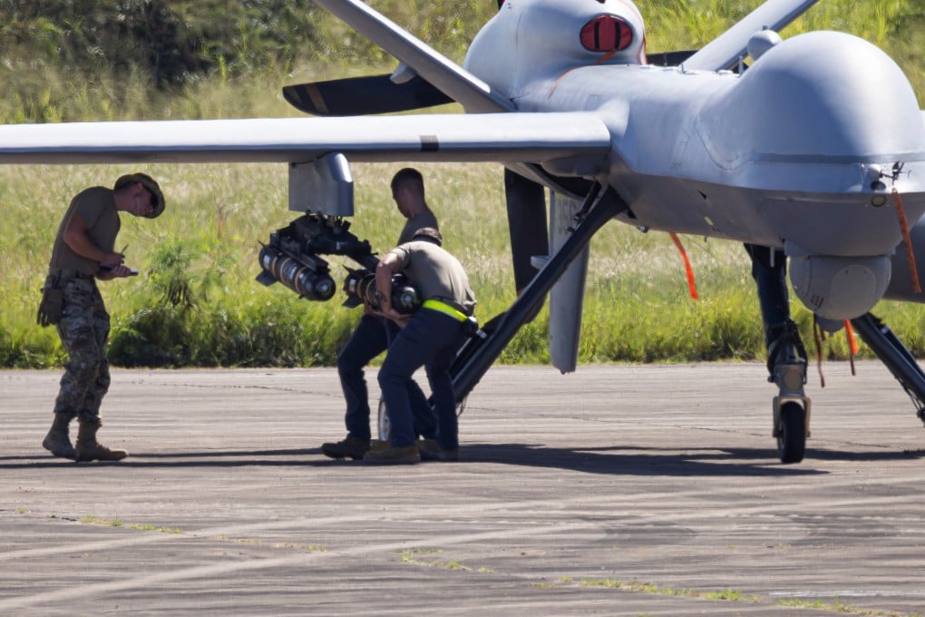 US Air Force personnel load missiles onto a MQ-9 Reaper drone at Rafael Hernandez Airport in Aguadilla, Puerto Rico. Photo: Reuters