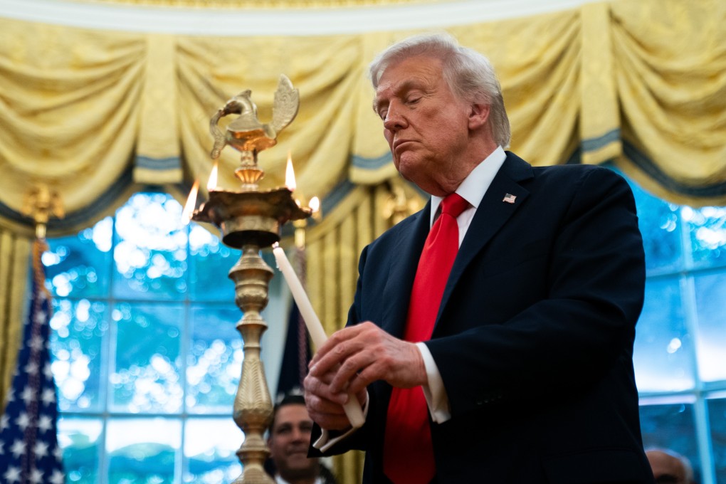 US President Donald Trump lights a lamp during a Diwali celebration at the White House in Washington on Tuesday. Photo: EPA