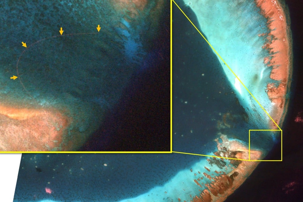 This satellite image obtained by Satellogic and distributed by SkyFi shows what appears to be a man-made barrier blocking the entrance to the lagoon at the Scarborough Shoal – known as Huangyan Island in China and Panatag Shoal in the Philippines – an atoll in the South China Sea that is claimed by both the Philippines and China. Photo: Satellogic via SkyFi