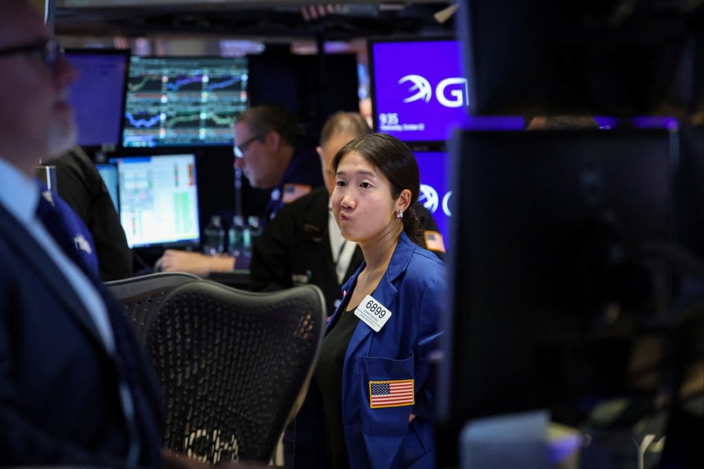 Traders work on the floor at the New York Stock Exchange on October 22. Just 10 companies account for over half the rise in the value of US stocks. Photo: Reuters