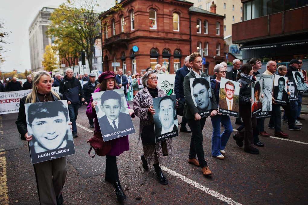 Relatives and supporters of the victims of the 1972 Bloody Sunday massacre march to Belfast Crown Court ahead of the verdict on the trial of a British soldier identified only as Soldier F, Belfast, in Northern Ireland, on Thursday. Photo: AP