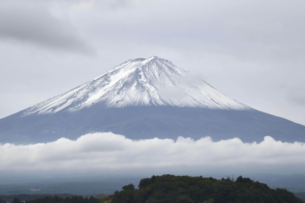 The season’s first snow-capped Mount Fuji, the Japan’s highest mountain, located on the borders of Shizuoka and Yamanashi prefectures, on Thursday. Photo: Kyodo