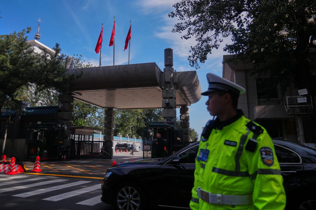 Chinese security personnel stand guard at the entrance to the Jingxi Hotel where the Communist Party’s Central Committee is holding its fourth plenum. Photo: AP