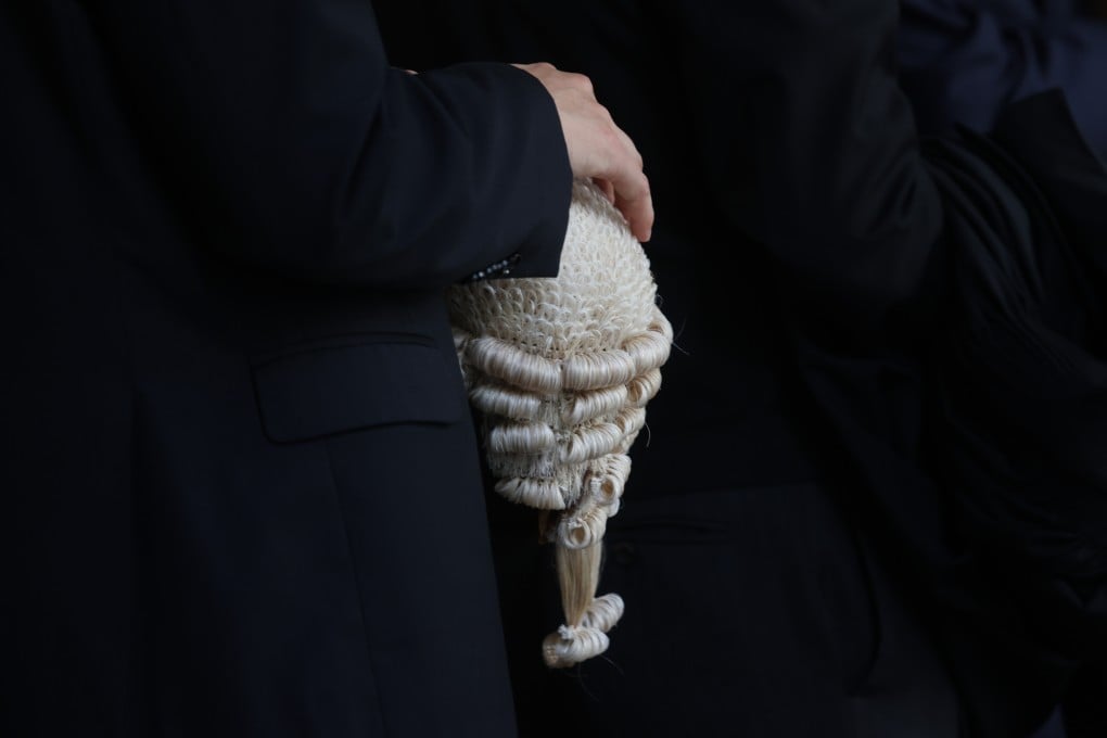 A barrister holds his wig at a senior counsel appointment ceremony, held at the High Court building in Central in May 2024. Photo: Yik Yeung-man.