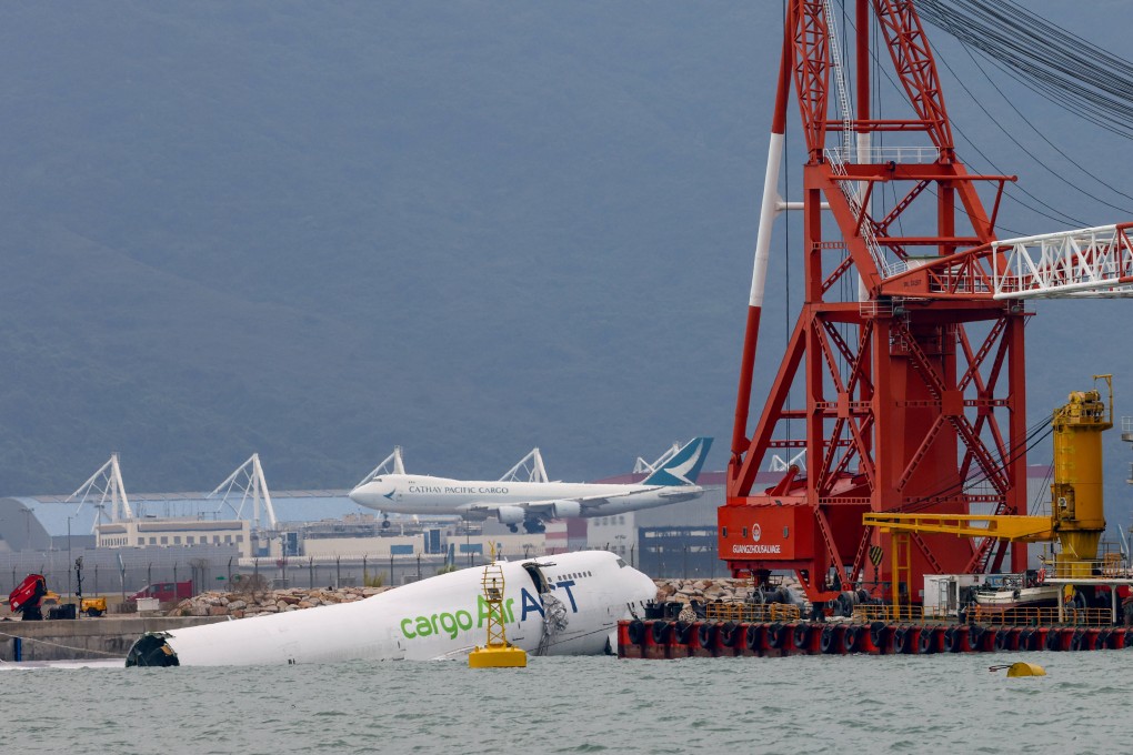 Securing and removing the cargo plane that crashed after veering off its path at Hong Kong’s airport and killing two security workers will take at least two days, experts say. Photo: Dickson Lee