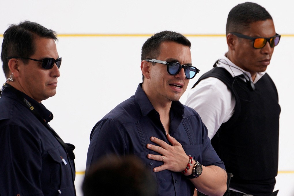 Ecuador’s President Daniel Noboa being escorted by security personnel. Photo: Reuters