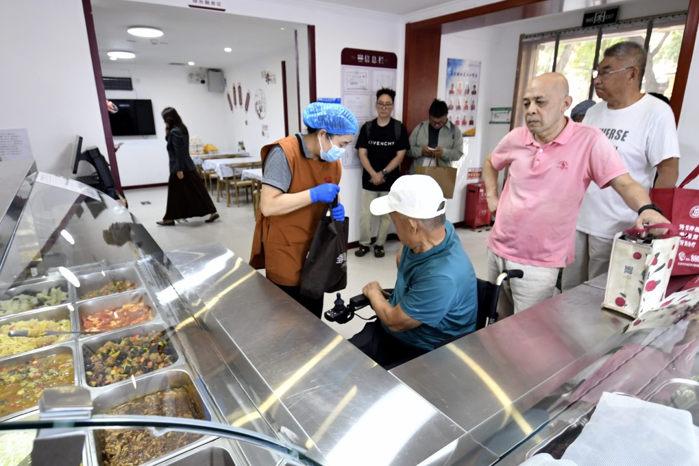 Senior citizens buy lunch at a community canteen in Beijing’s Chaoyang district last month. Photo: Xinhua