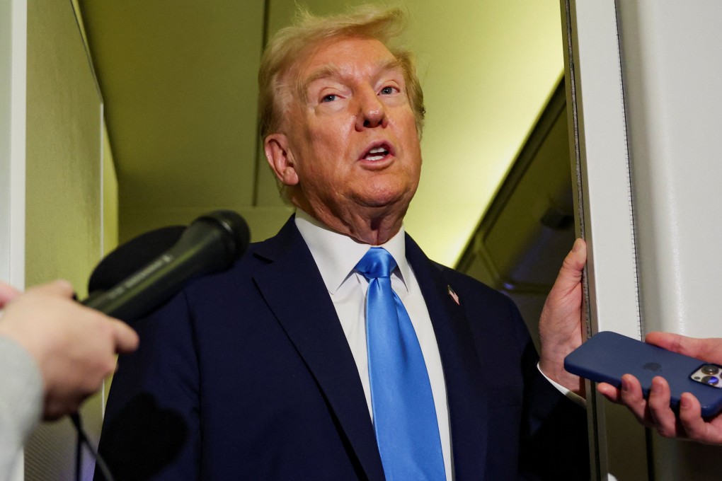 US President Donald Trump speaks to the media aboard Air Force One on Friday. Photo: Reuters