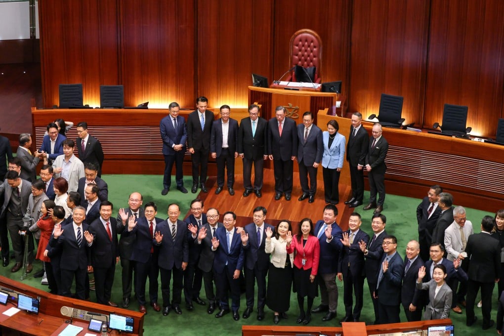 Lawmakers gather for photos with outgoing Legco president Andrew Leung Kwan-yuen after the end-of-term final meeting in the Legco chamber on October 23. Photo: Nora Tam