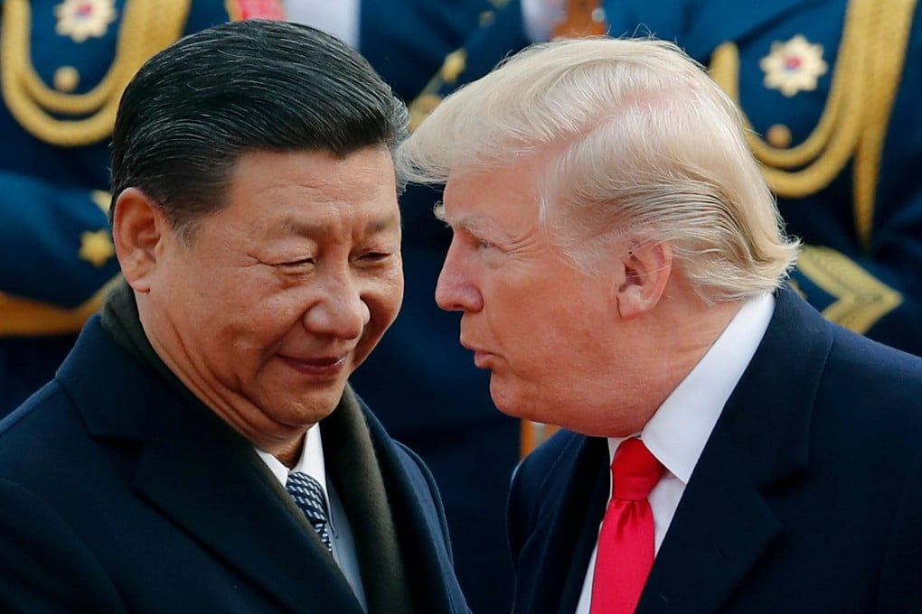 US President Donald Trump chats with Chinese President Xi Jinping during a welcome ceremony at the Great Hall of the People in Beijing in November 2017. Photo: AP