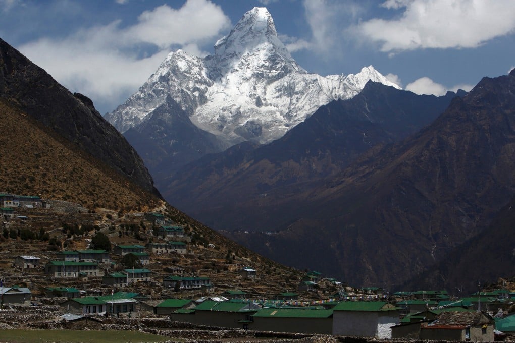 Mount Ama Dablam towers over Khumjung village in Solukhumbu district. Photo: Reuters