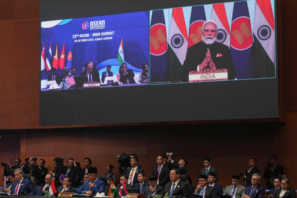 India’s Prime Minister Narendra Modi appears on a screen to deliver a speech remotely during the Asean summit in Kuala Lumpur on Sunday. Photo: AFP