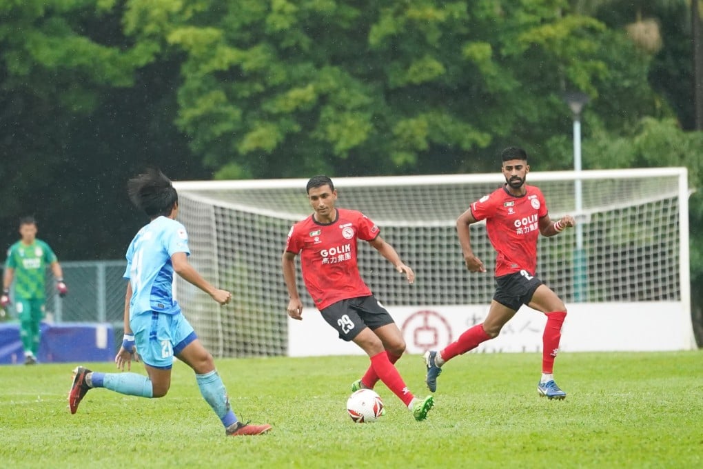 Jahangir Khan (middle) is enjoying his season as North District sit perched at the top of the Premier League. Photo: North District FC