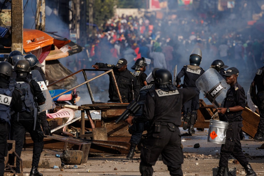 Security forces remove barricades during a protest by supporters of Cameroon presidential candidate Issa Tchiroma, who claimed victory in the October 12 presidential election, in New Bell neighbourhood, Douala, Cameroon on Sunday. Photo: Reuters