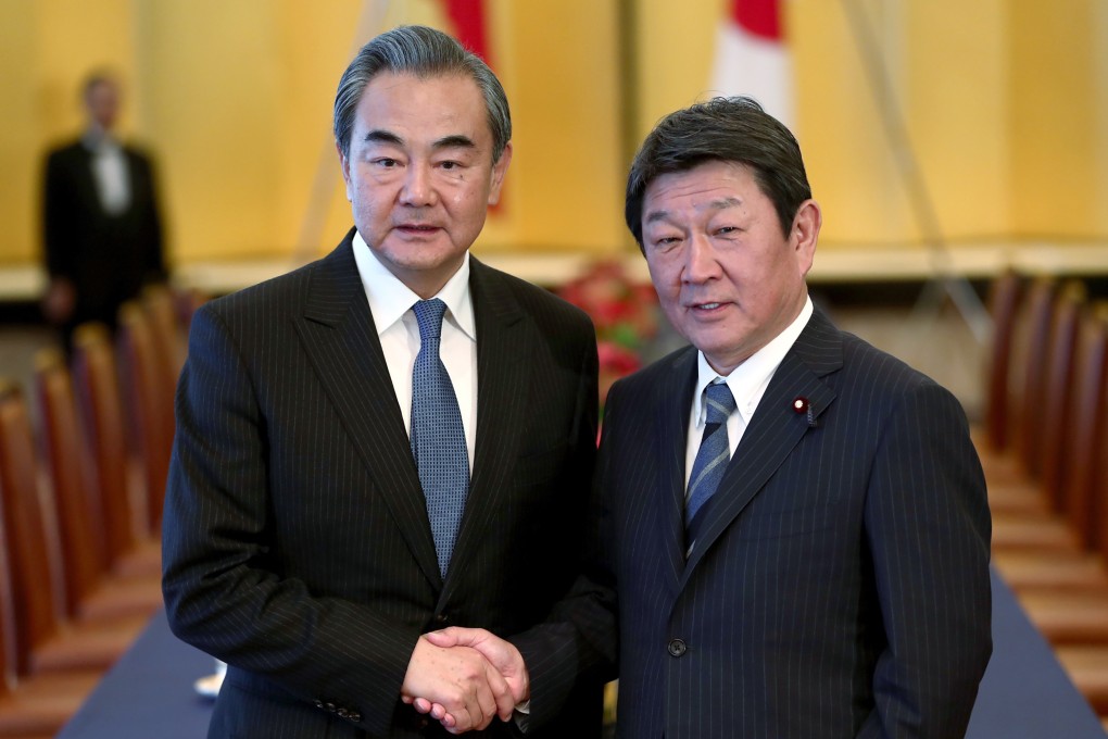 Chinese Foreign Minister Wang Yi (left) spoke by phone with his Japanese counterpart Toshimitsu Motegi on Tuesday. Photo: AP