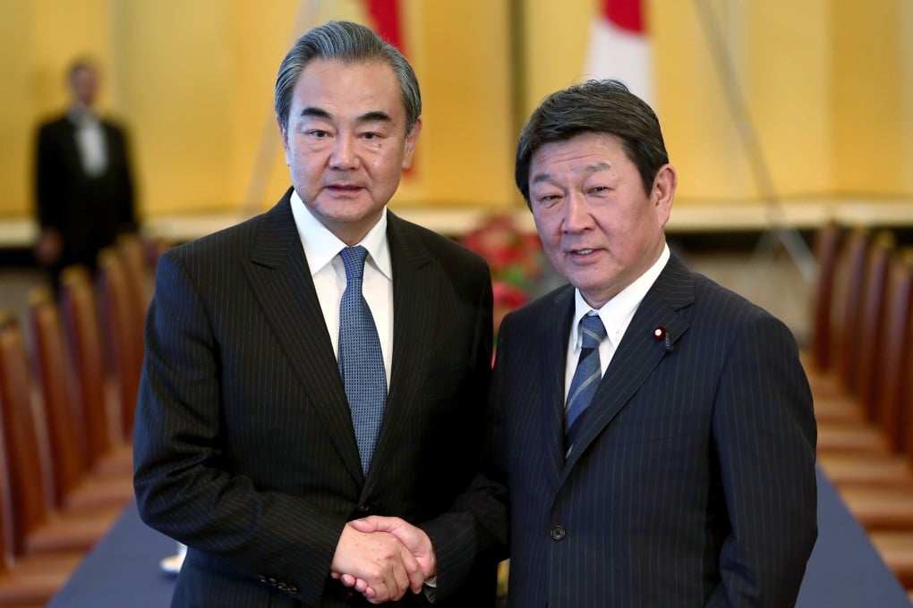 Chinese Foreign Minister Wang Yi (left) spoke by phone with his Japanese counterpart Toshimitsu Motegi on Tuesday. Photo: AP