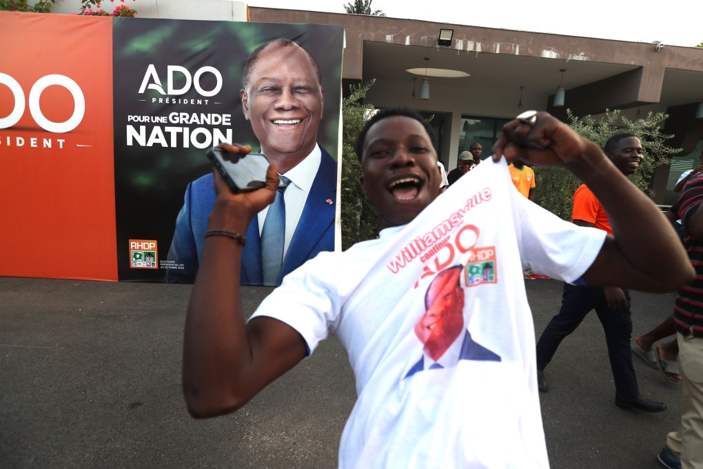 A supporter of President Alassane Ouattara celebrates on Monday. Photo: Xinhua