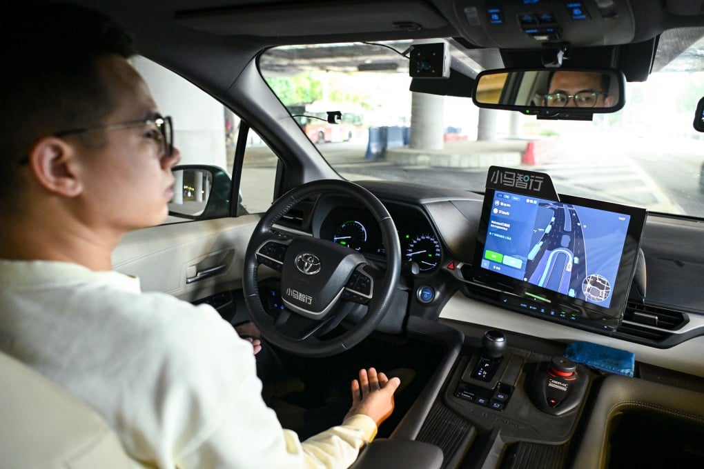 A safety driver observes as a Pony.ai robotaxi drives on the road in Guangzhou, south China’s Guangdong province, March 11, 2025. Photo: Xinhua