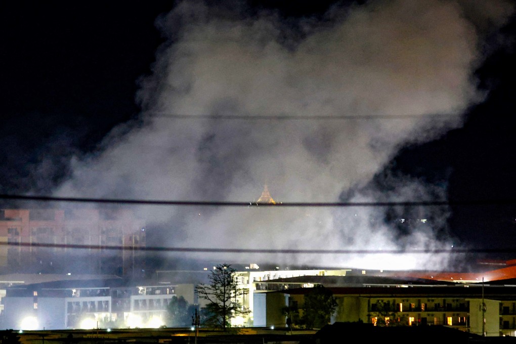 Smoke rises over buildings following an explosion in the KK Park compound. More than 1,500 people have fled from Myanmar into Thailand this week after the Myanmar military raided one of the country’s largest scam centres. Photo: AFP
