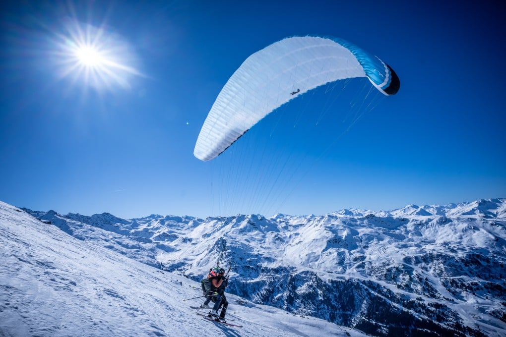 Ski paragliders, or ski-gliders, take off for flight in the Les 3 Vallées. One writer’s ski holiday in the French Alps ski region was elevated by partaking in this adrenaline-inducing activity. Photo: dpa/picture alliance via Getty Images
