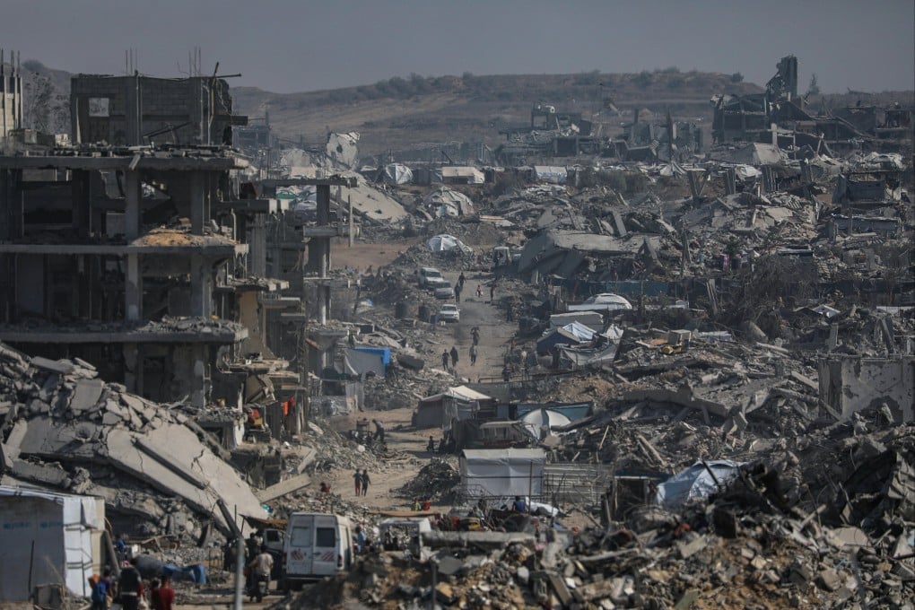 Palestinians move among the rubble of destroyed buildings in the heavily damaged Sheikh Radwan neighbourhood of Gaza City on October 23. Photo: EPA