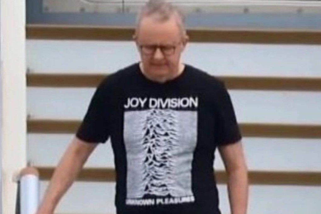Prime Minister Anthony Albanese wears a Joy Division T-shirt upon returning from Washington on October 23, 2025. Photo: Facebook/Betar US