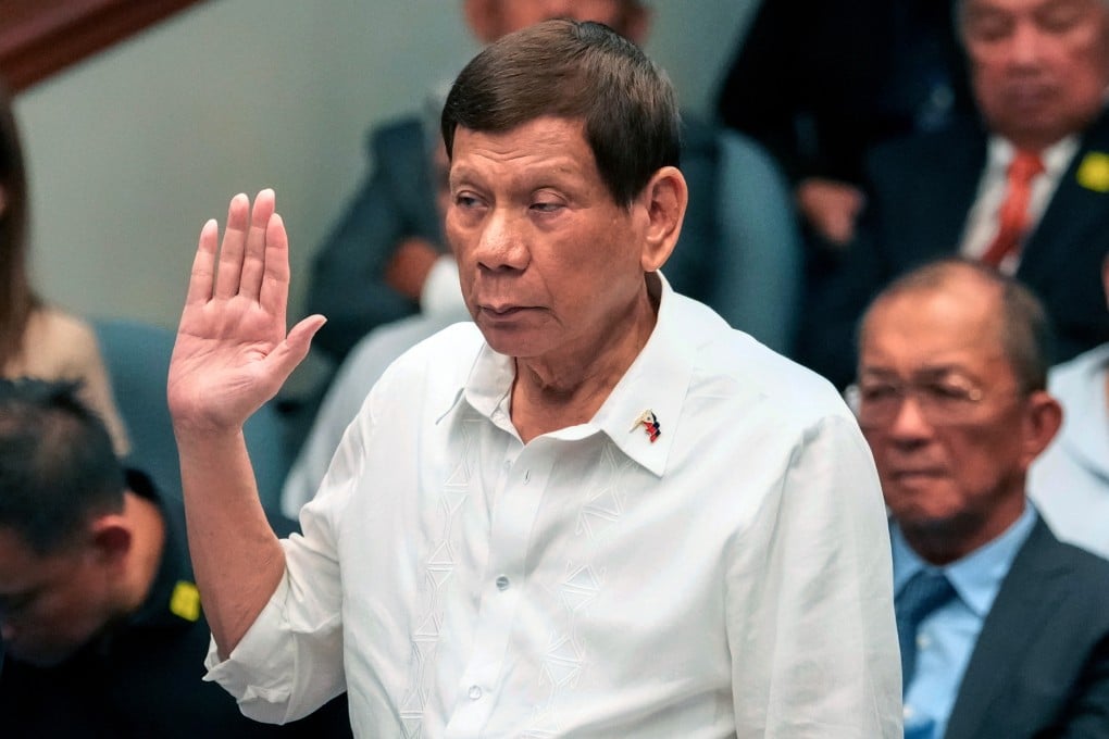 Former Philippine President Rodrigo Duterte takes oath during a senate inquiry on the so-called war on drugs during his administration at the Philippine Senate in Manila last year. Photo: AP