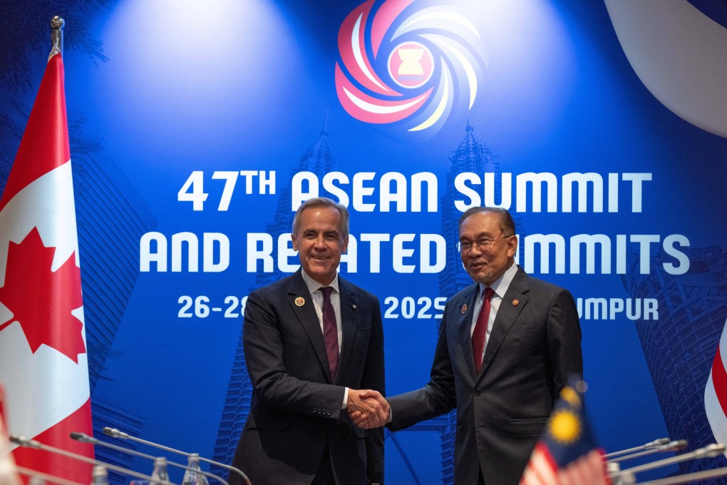 Canadian Prime Minister Mark Carney (left) shakes hands with his Malaysian counterpart Anwar Ibrahim at the start of a bilateral meeting at the Asean Business and Investment Summit in Kuala Lumpur on Monday. Photo: The Canadian Press via AP