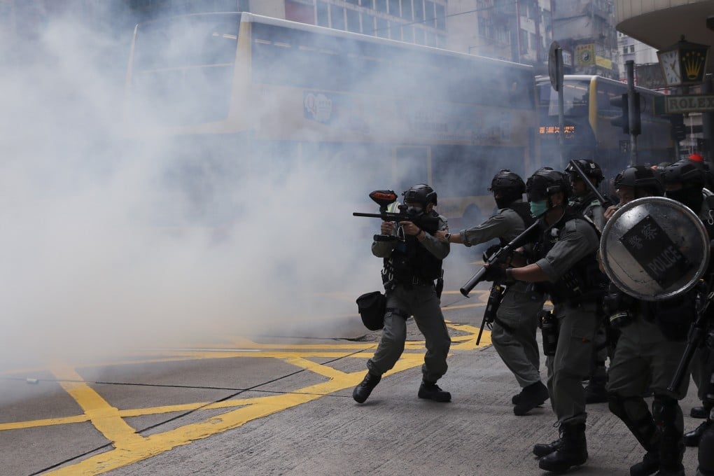 Riot police fire tear gas in Causeway Bay during the anti-government demonstrations. Photo: Sam Tsang