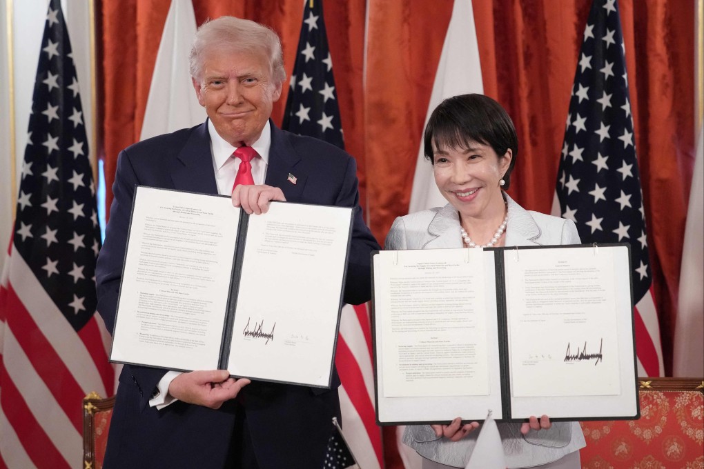 US President Donald Trump and Japanese Prime Minister Sanae Takaichi hold up signed documents for a critical minerals deal at Akasaka Palace on October 28 in Tokyo, Japan. Photo: AFP
