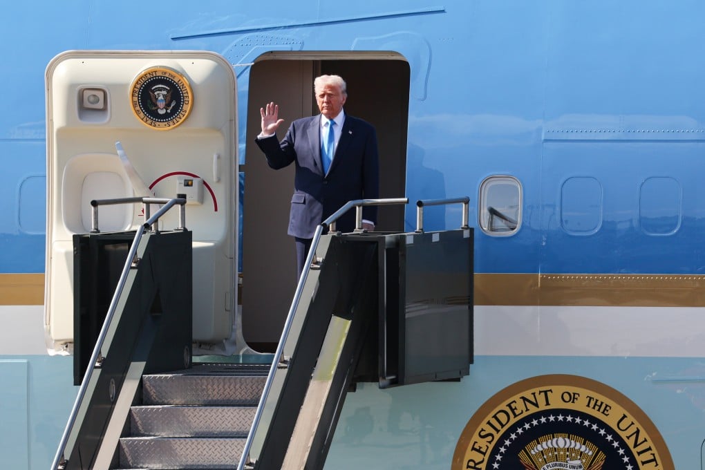 US President Donald Trump waves as he disembarks from Air Force One at Gimhae International Airport in Busan, South Korea, on Wednesday. Photo: EPA/Yonhap