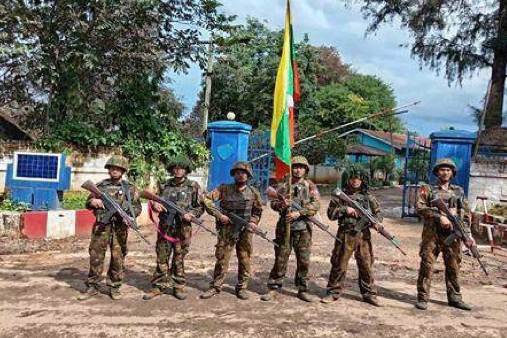 Myanmar’s soldiers stand in front of a captured police station in Kyaukme, a town in Shan state that the resistance forces had controlled for more than a year. Photo: AP