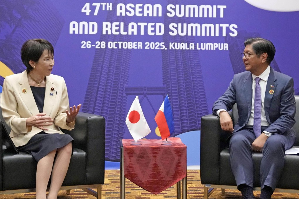 Japanese Prime Minister Sanae Takaichi (left) talks with Philippine President Ferdinand Marcos Jnr in Malaysia on Sunday. Photo: Kyodo