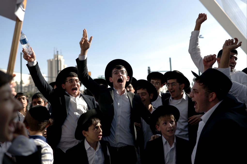Ultra-Orthodox Jews shout slogans during a protest rally against the army recruitment bill in Jerusalem on Thursday. Photo: EPA
