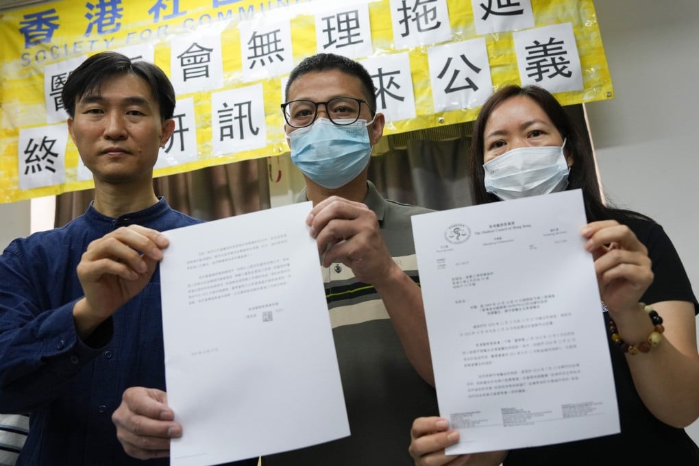 Tim Pang (left) with the baby’s parents Lai Zhijin and Peng Hongying at a press conference in Sham Shui Po on October 29. Photo: Jelly Tse