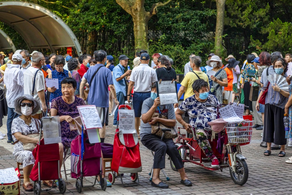 Elderly parents display information about their children in the marriage market in People’s Square in Shanghai in 2020. Photo: EPA-EFE
