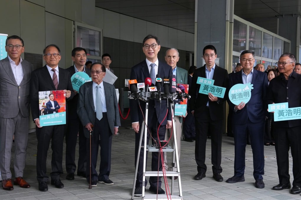 Augustine Wong (centre) announces his intention to run in the coming Legco election. Photo: Jelly Tse