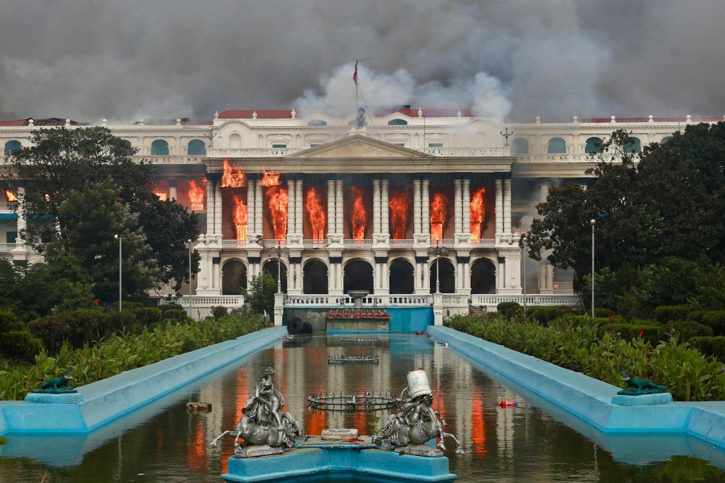 Fires rage in the Singha Durbar, the Nepalese government’s main administrative building, in Kathmandu on September 9. Photo: AFP