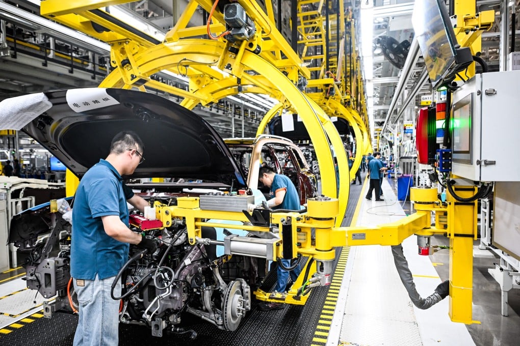 People work on a production line at an automotive factory in China’s southwestern city of Chongqing. Photo: Xinhua