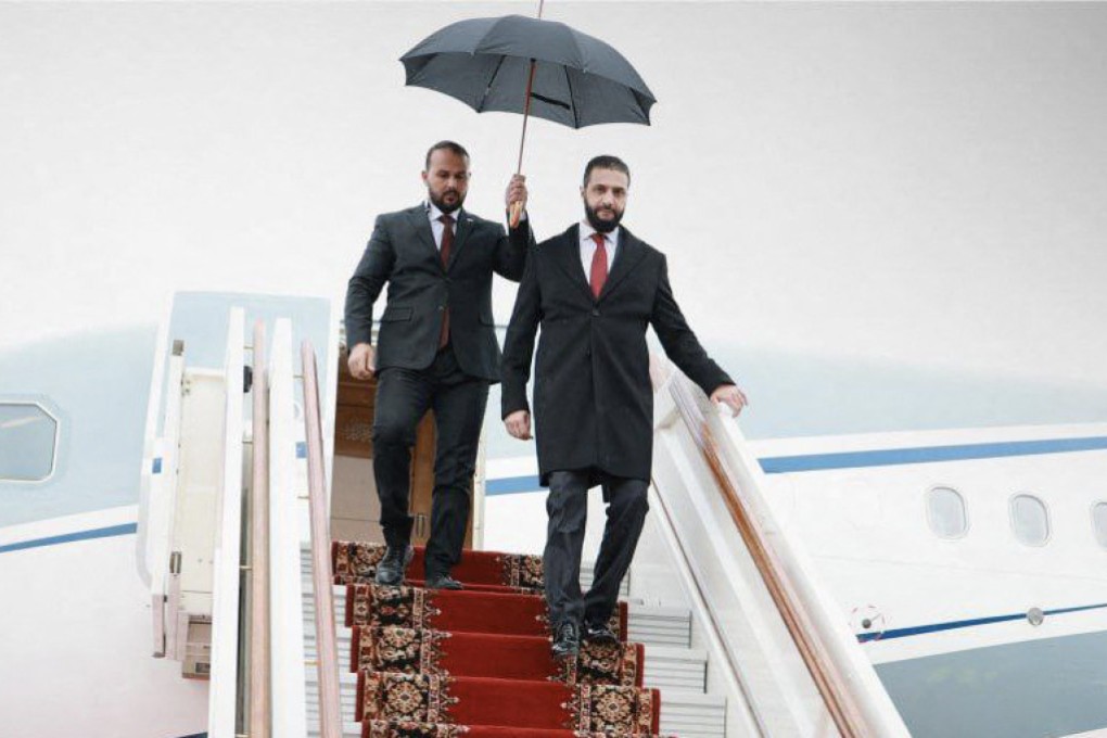 Syria’s interim President Ahmed al-Sharaa (right) disembarks from a plane during a state visit to Russia on October 15. He is expected to visit Beijing this month. Photo: Syrian Arab News Agency/AFP