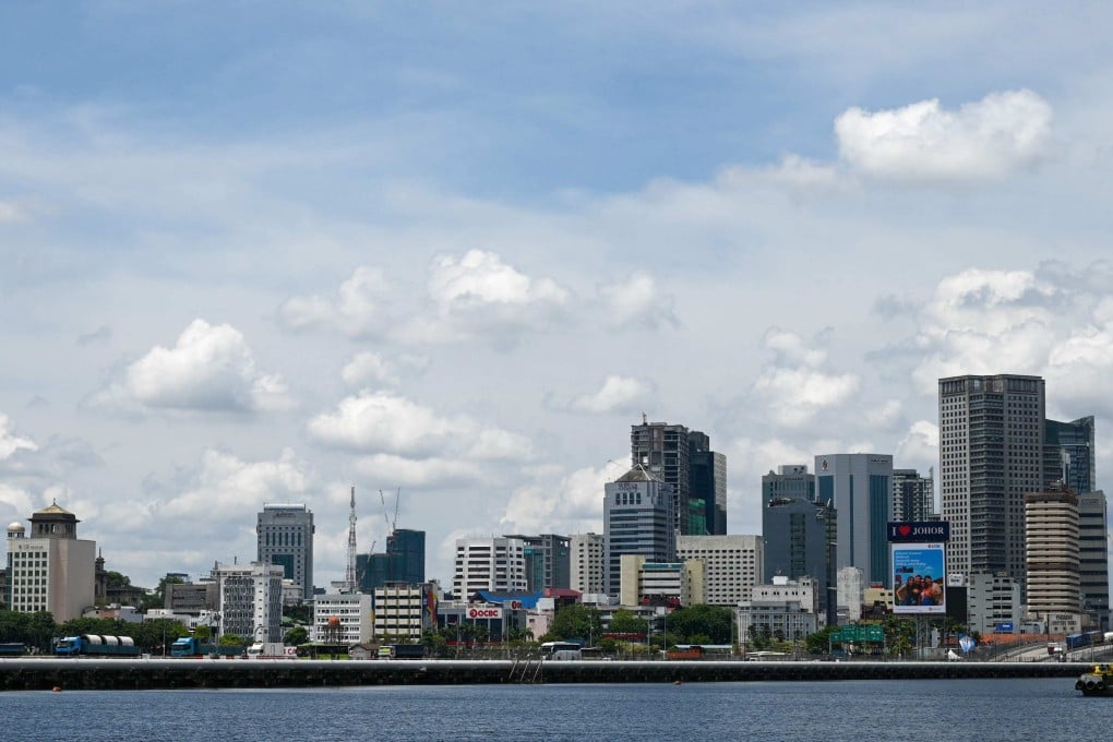 Vehicles travel across the causeway from Malaysia’s southern state of Johor to Singapore. Photo: AFP