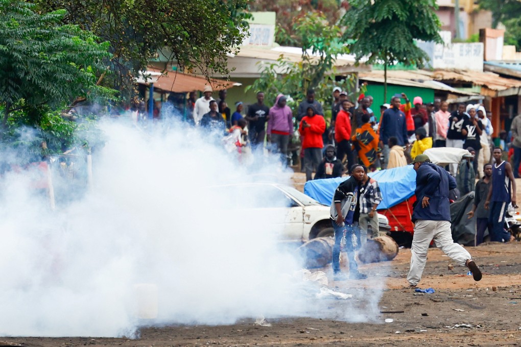 Tanzanian riot police officers use tear gas to disperse demonstrators at the Namanga One-Post Border crossing point between Kenya and Tanzania on Thursday. Photo: Reuters
