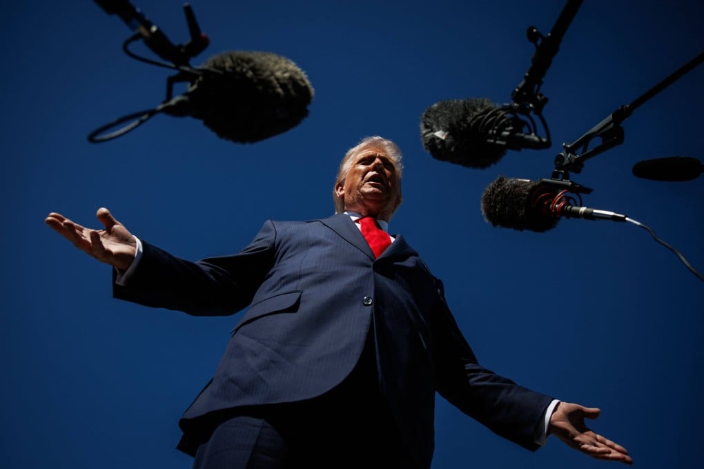 US President Donald Trump speaks to reporters as he arrives at Palm Beach International Airport on Friday in Florida. Photo: Getty Images