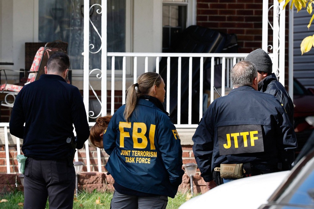Members of the FBI Joint Terrorism Task Force take part in a search on a home in Dearborn, Michigan, on Friday. Photo: AFP