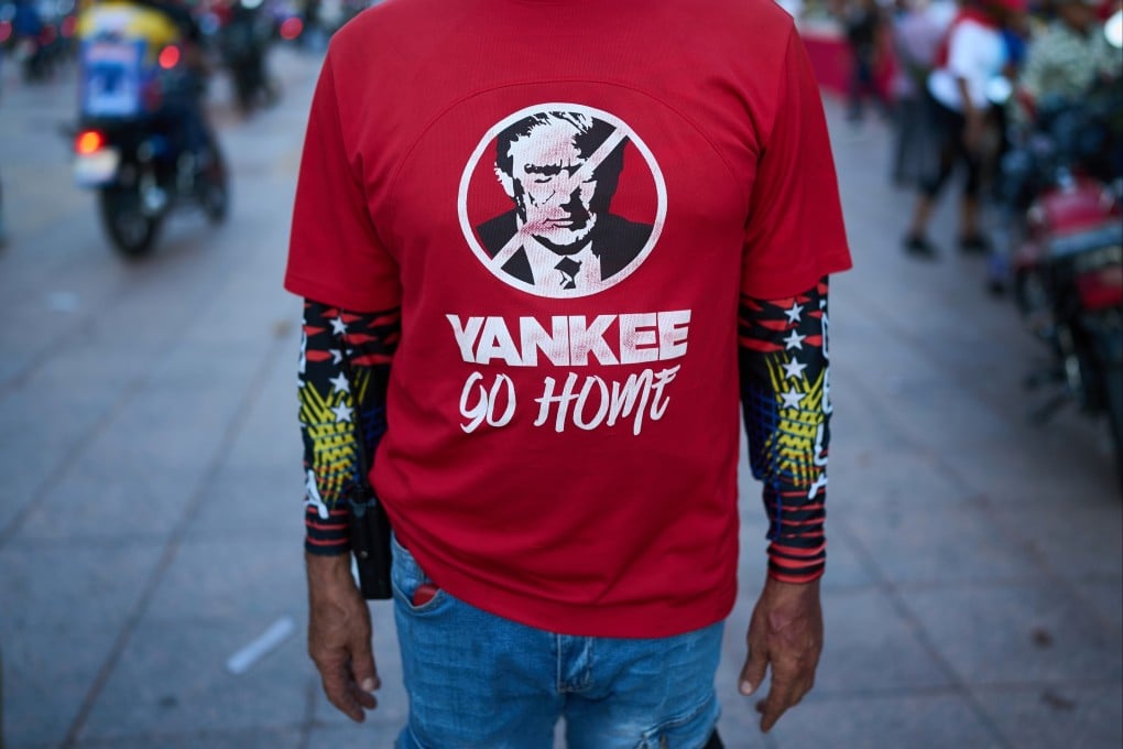 A man wears an anti-Trump shirt during a rally against foreign interference in Caracas, Venezuela, on Thursday. Photo: AP